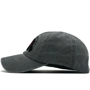 Detail showing the national park bear embroidery on washed dark gray cotton baseball cap