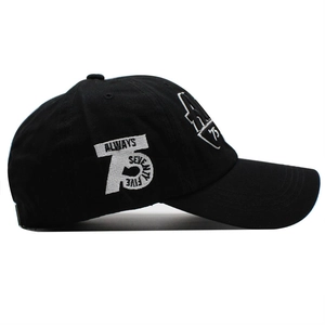 Classic black cotton baseball cap with white 3D embroidery showing number 75 and text