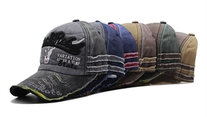 Detailed row of vintage washed cotton baseball caps with Rock Rebel bull head embroidery