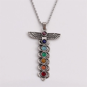 Silver caduceus pendant necklace with seven colorful chakra stones on white background