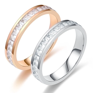 Close-up of rose gold and silver titanium steel rings with square cubic zirconia stones