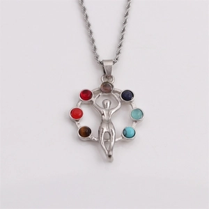 Detailed shot of silver chakra necklace featuring a yoga figure pendant with seven gemstones