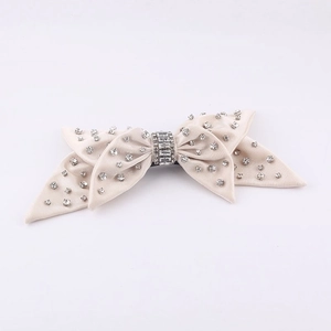 Elegant beige velvet bow hair clip with sparkling rhinestones for women's fashion hair style