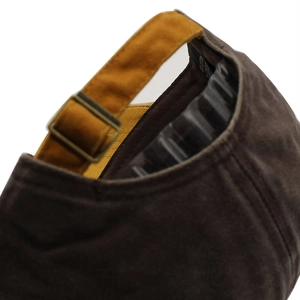 Rear view of vintage washed baseball cap with adjustable mustard strap and brass buckle