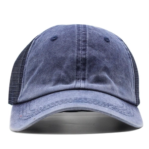 Distressed dark blue denim trucker hat with black mesh back and curved brim for men and women