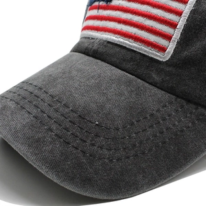 Close-up of the vintage washed grey cotton fabric and American flag embroidery detail