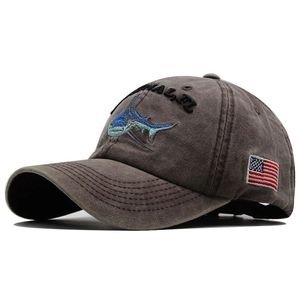 Close-up of vintage washed cotton baseball cap with shark embroidery and US flag detail