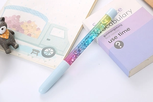 Detailed shot of creative liquid quicksand pen with colorful glitter and blue accents