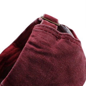 Back view of burgundy cotton baseball cap featuring adjustable metal buckle and strap