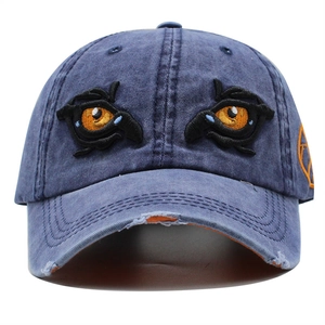Distressed navy blue baseball cap with eye embroidery and washed cotton denim texture