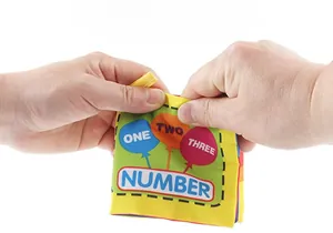 Macro shot of durable, tear-resistant fabric baby book with colorful number illustrations