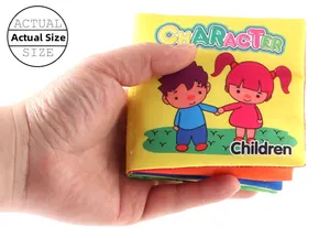 Adult hand holding a yellow educational soft cloth book for toddlers to show actual size
