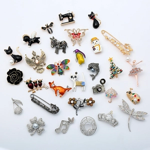 Collection of colorful enamel animal and plant brooches with pearls and rhinestones