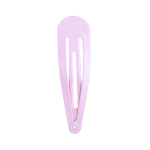 Detail view of pink lacquer finish on a metal snap hair clip with a smooth surface