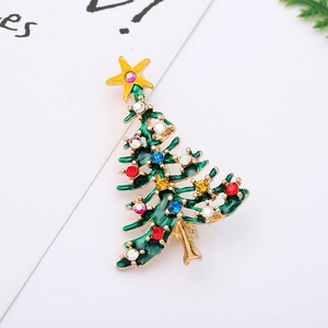 Detailed close-up of a Christmas tree enamel brooch with colorful rhinestones and gold trim