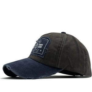 Vintage washed cotton baseball cap with distressed brim and nautical patch detail