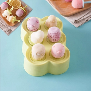 Mini silicone ice pop molds in pastel green with 6 animal shapes and colorful handles