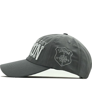Detail of gray baseball cap featuring premium 3D embroidery of ICON and OF CITY text