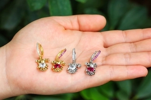 Cute bear earrings set in gold and silver finish with sparkling heart-shaped zircons