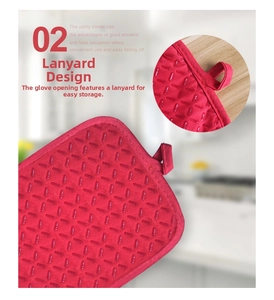 Detail showing the red heat-resistant oven mitt with anti-slip silicone grip and hanging loop