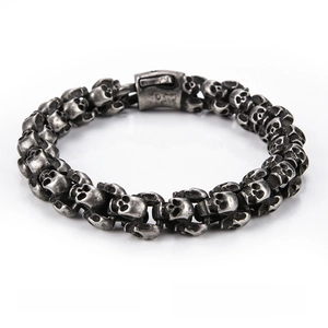 Macro detail of retro gothic punk skull linked bike chain bracelet in titanium steel
