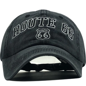 Close-up of Route 66 white embroidery on vintage washed black cotton baseball cap