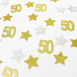 Sparkling gold and silver number 50 and star shaped confetti for 50th birthday party