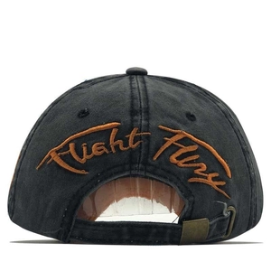 Detailed view of Flight Fury embroidery and adjustable metal buckle on baseball cap