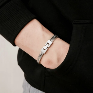 Men's silver stainless steel dragon bone chain bracelet with geometric clasp on wrist