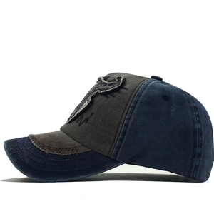 Detail view of vintage washed baseball cap featuring contrast stitching and cow patch