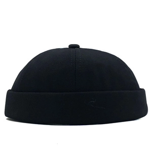 Detail of a black cotton Miki Hat featuring a classic six-panel design and rolled brim