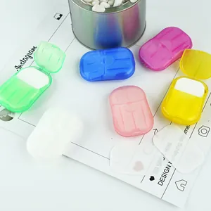 Macro detail of portable soap sheets in colorful mini cases for outdoor travel hygiene