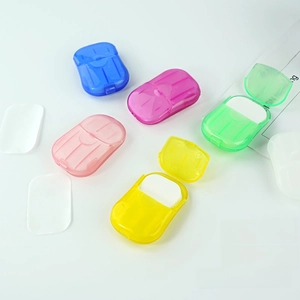 Detailed view of five colorful portable soap paper containers with thin soap flakes inside