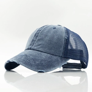 Distressed dark blue denim trucker hat with breathable mesh and retro washed cotton finish