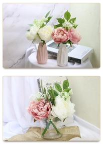 Detailed view of pink and white faux peony bouquet in ceramic and glass vases