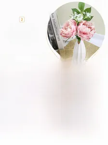 Detailed view of artificial peony bouquet featuring realistic silk petals and green foliage