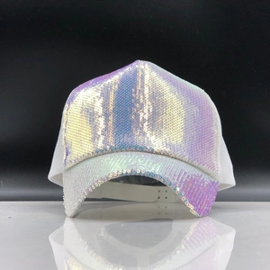 Close-up of holographic sequins on white baseball cap with breathable mesh back panels