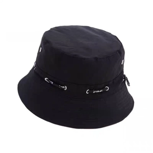 Detail of black bucket hat with metal eyelets and adjustable character drawstring cord