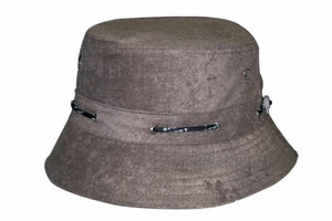 Detail of a brown suede bucket hat featuring metal eyelets and sport print drawstrings