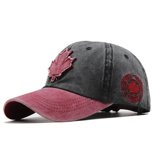 Vintage cotton baseball cap with red Canada maple leaf embroidery in charcoal grey