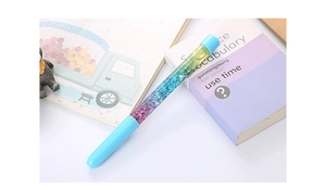Detail of creative liquid quicksand gel pen with blue cap and colorful gradient glitter