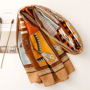 Carriage print scarf in orange and brown with equestrian motifs and plaid pattern