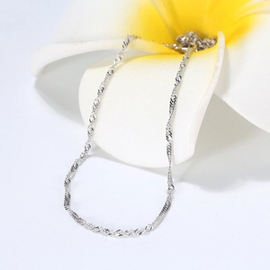 Elegant silver S925 sterling silver water wave chain draped on a frangipani flower