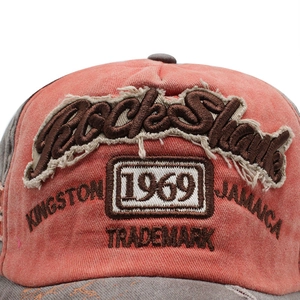 Vintage washed baseball cap with Rock Shark embroidery and gray brim on orange crown
