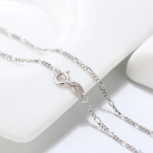 Macro view of S925 sterling silver Figaro chain showing spring clasp and ITALY hallmark