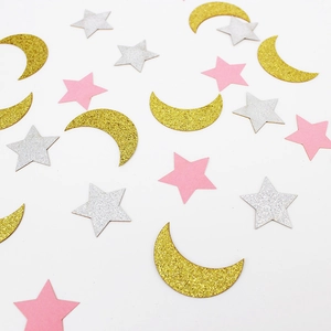 Glittery gold, silver and pink star and moon confetti for wedding party decorations