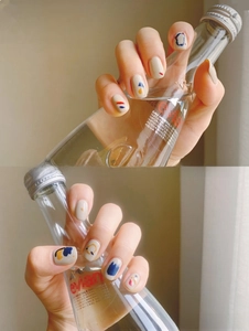 Detailed view of 3D summer nail art stickers featuring abstract geometric colorful patterns