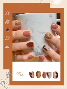 Detail of 3D summer nail stickers featuring abstract lines and warm caramel tones