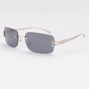 Lunettes de soleil sans monture avec décorations d'étoiles et verres gris fumé