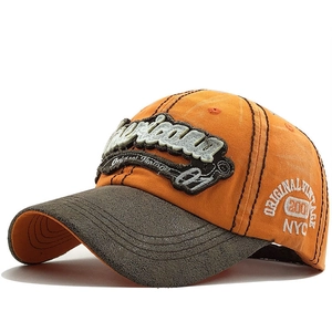 Detail of vintage baseball cap with washed cotton texture and NYC embroidery
